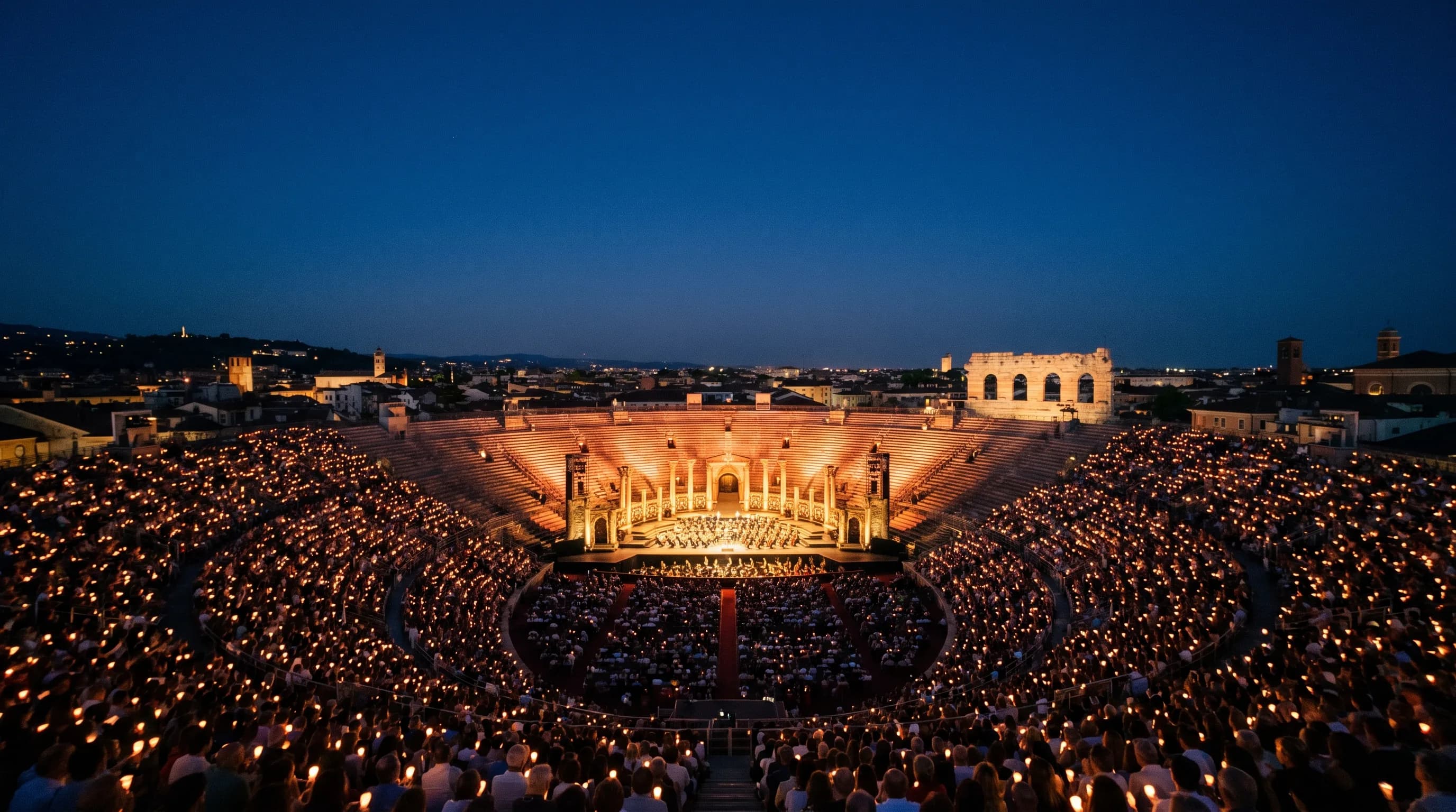 The Verona arena lit for a summer opera performance at night.
